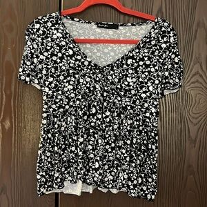 Brit & Bri black with white flower pattern. Short with large ruffled bottom. S